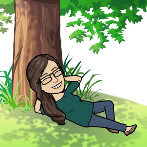 BitmoJo resting and reflecting on a novel under a tree.